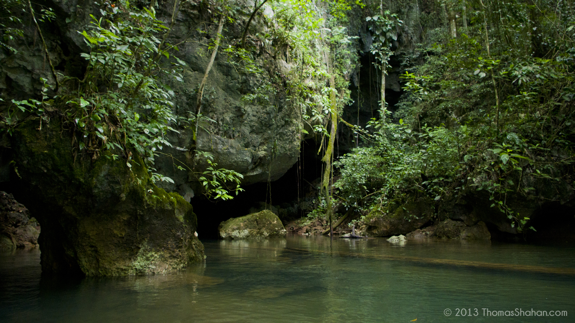 Cave tubing through limestone caves in Belize rainforest on a shore excursion for cruise passengers from Belize City port